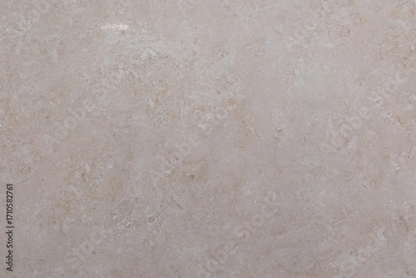 Fototapeta Smooth beige stone surface showcasing natural patterns and textures ideal for home decor