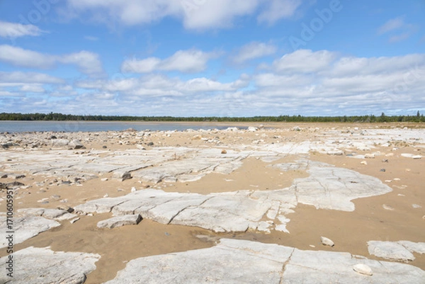 Obraz Rugged limestone shoreline at Misery Bay Provincial Park on Manitoulin Island, Ontario, under a blue sky.
