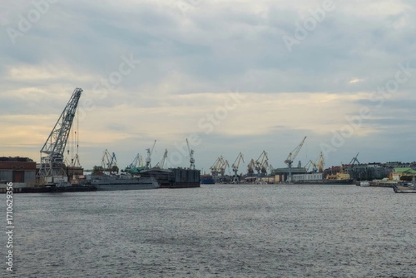 Fototapeta Gloomy port, twilight view from distance.