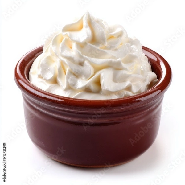 Fototapeta Whipped cream in brown bowl on white background studio shot close up dessert topping sweet dairy product