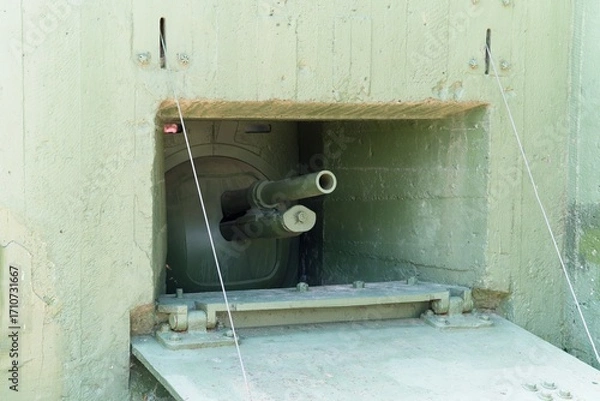 Fototapeta Minsk region, Belarus, July 12, 2025. Embrasure of a concrete pillbox on the Stalin Line.                               