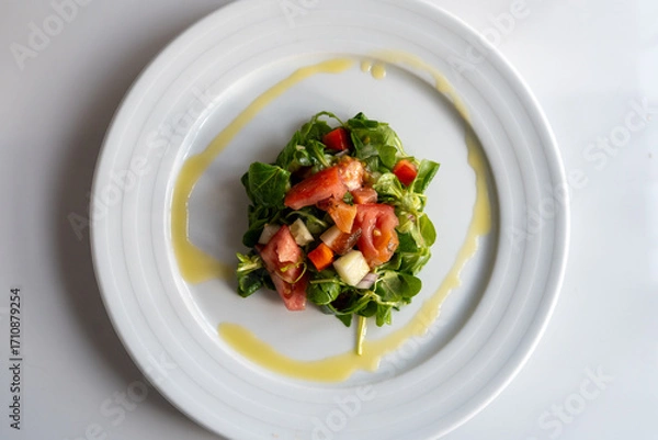 Obraz homemade recipe for green salad with tomato and oil