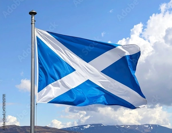 Fototapeta The national flag of Scotland flapping on a pole against sky background