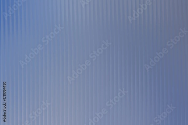 Fototapeta A light blue vertical pattern with subtle variations in tone creating a textured appearance all over