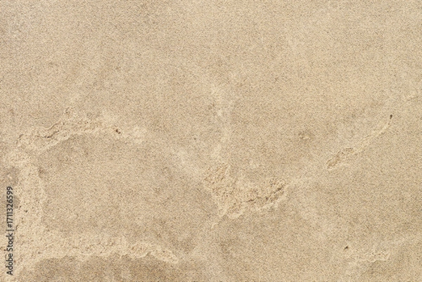 Fototapeta Textured beige surface great for backgrounds, wallpapers, and designs inspired by nature, earth tones, and rustic aesthetics. Sandlike texture.