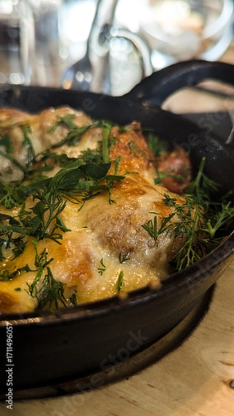 Obraz Roasted potatoes with bacon and cheese. Restaurant food closeup.