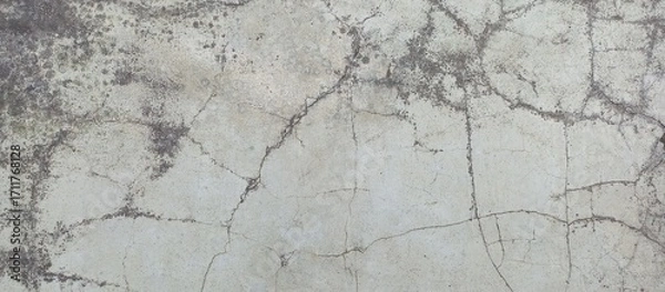 Fototapeta Detailed closeup of a cracked and dirty concrete surface
