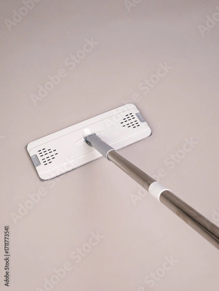 Obraz Modern mop with metal handle on grey background