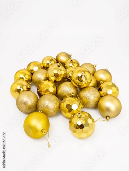 Obraz Golden Christmas tree toy balls on white background, Christmas and New Year concept, space for text