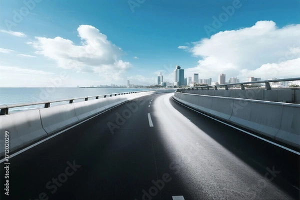Fototapeta Smooth highway leading to a modern city with clear sky