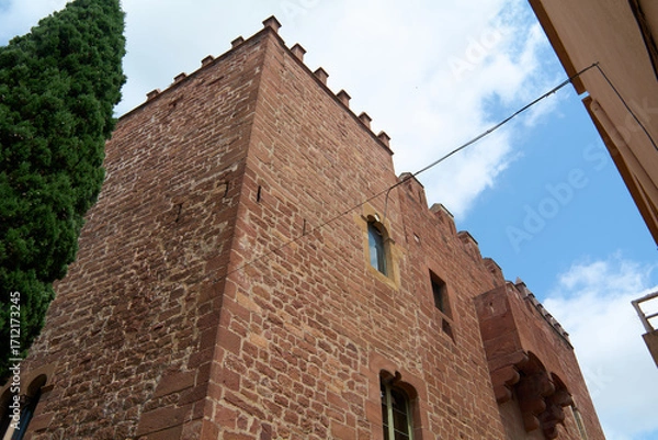 Fototapeta View of a medieval tower with gothic architecture.