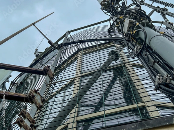 Fototapeta Antenna structures at the top of the Niechorze Lighthouse on the Baltic Sea in Poland