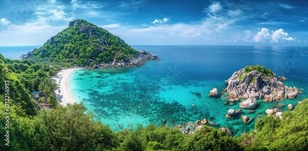 Obraz Panoramic photo of a beautiful island, with crystal-clear water, white sandy beaches, and coral reefs visible in the shallow waters.