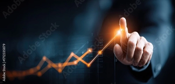 Fototapeta Business growth concept with hand pointing at rising graph.