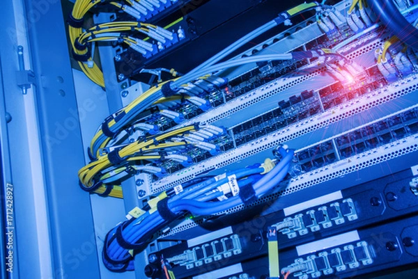 Fototapeta Network Cables and Equipment in Server Room Setup