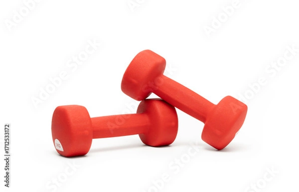 Fototapeta Red dumbbells on white background. Studio shot.