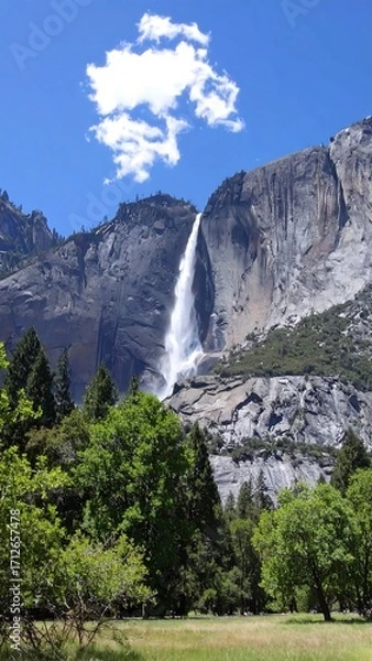 Obraz Majestic waterfall cascading down granite cliffs