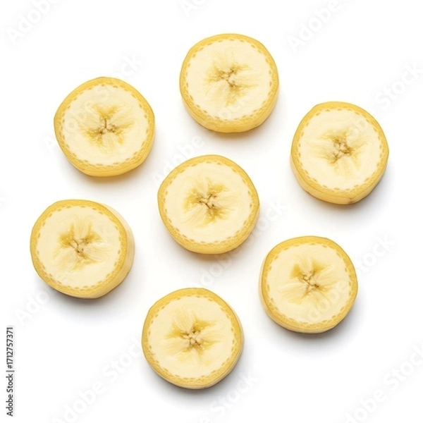 Obraz Banana slices isolated on a white background. Flat lay, top view