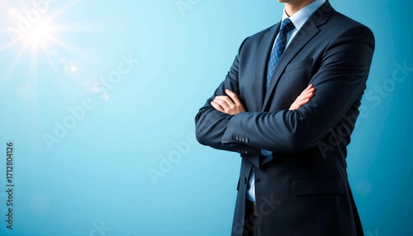 Fototapeta Professional businessman in formal suit standing confidently with arms crossed, partial close-up torso view