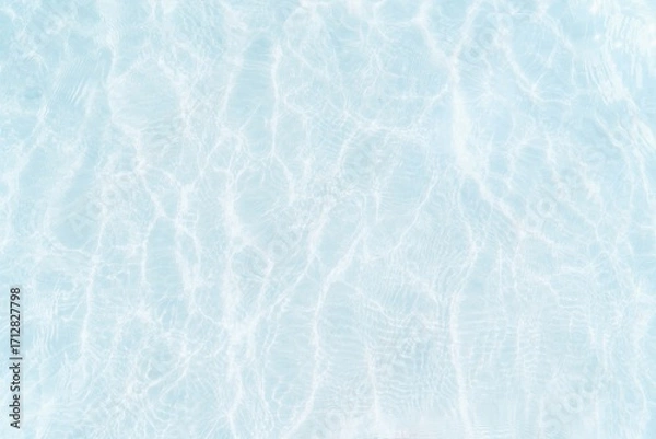 Fototapeta The texture of the shallow water surface, with characteristic reflections and distortions created by ripples, creates a feeling of calm and freshness.