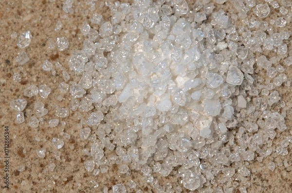 Fototapeta Sodium benzoate, a frequent preservative in sour food products, is commonly found in powdered or granular form in beverages like soft drinks and fruit juices.