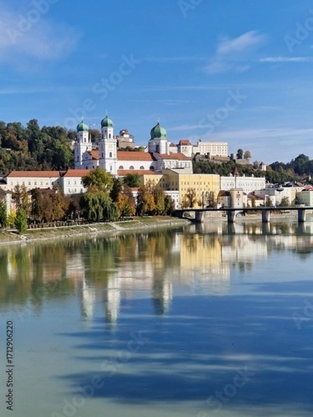 Fototapeta Sightseeing tour of the famous city of Passau. View across the Danube to the passenger harbour, the old town with the town hall and Passau Cathedral (Stephen's Cathedral).