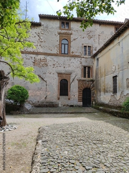 Fototapeta Lunghezza, Rome - April 15, 2025, detail of part of the courtyard of Lunghezza Castle, a medieval castle in the municipality of Rome.