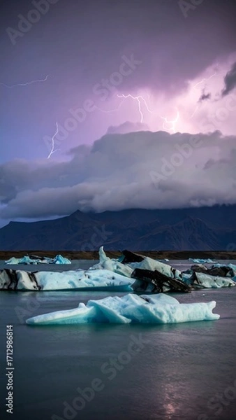 Obraz Dramatic icebergs illuminated by stormy sky