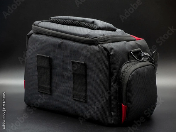 Fototapeta Generic black and red camera bag with shoulder strap, camera bag concept