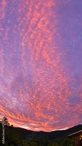 Fototapeta Sunset, beautiful rosy clouds, and the afterglow on the horizon