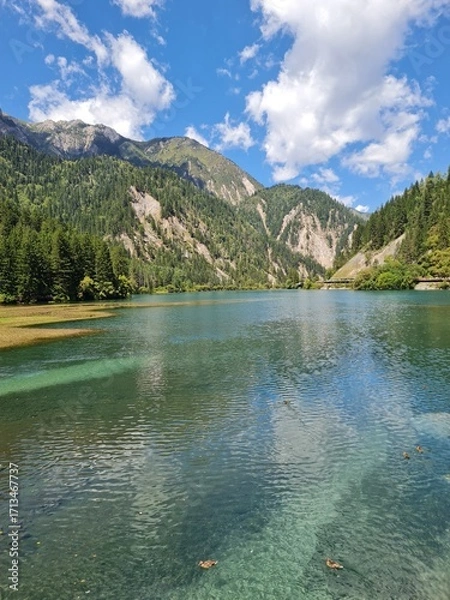 Fototapeta Reflection on the surface of a lake in summer in Jiuzhaigou National Park, China.