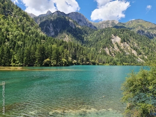 Fototapeta Reflection on the surface of a lake in summer in Jiuzhaigou National Park, China.