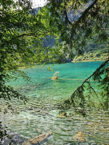 Fototapeta Reflection on the surface of a lake in summer in Jiuzhaigou National Park, China.