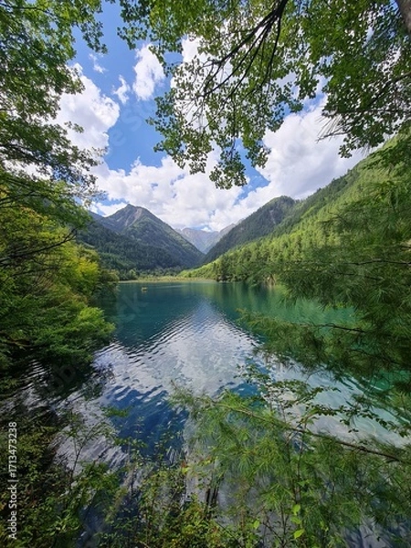 Fototapeta Reflection on the surface of a lake in summer in Jiuzhaigou National Park, China.