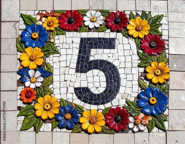 Fototapeta A vibrant number 5 crafted from an array of colorful flowers and lush green leaves, showcasing intricate details and a natural, organic design.