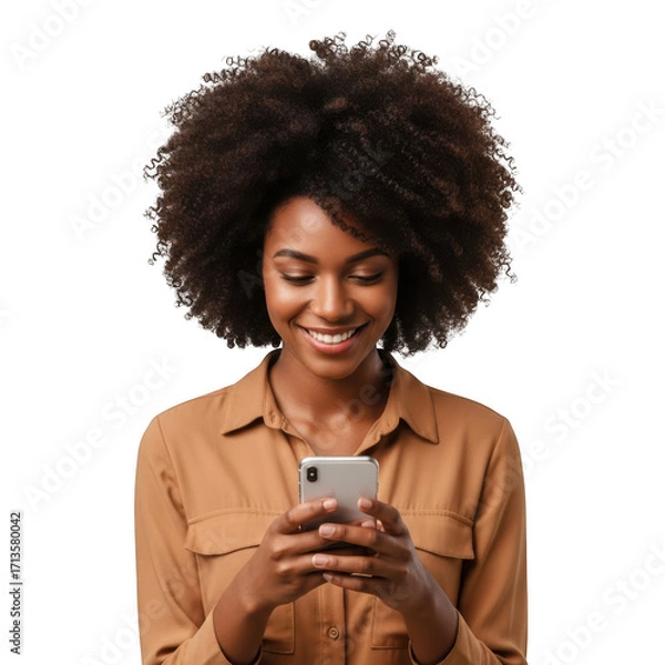 Obraz A young woman with voluminous curly hair smiling while looking at her mobile phone isolated on transparent background