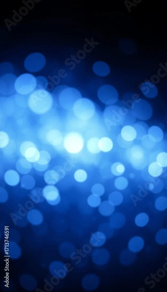 Fototapeta Radiant blue abstract glowing bokeh particles in dreamy light design