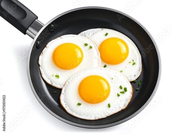 Fototapeta Three fried eggs in a pan