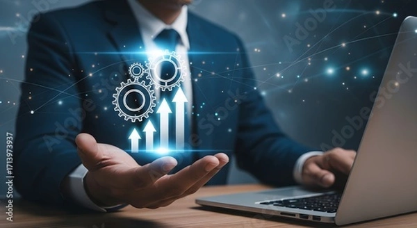 Fototapeta Businessman in suit using laptop with digital display of gears and upward trending arrows symbolizing growth and progress.