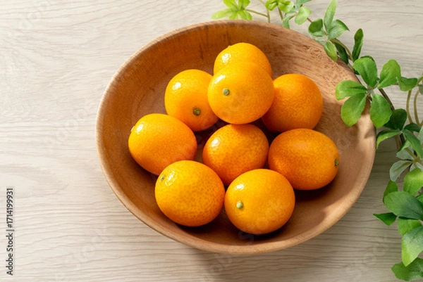 Fototapeta 新鮮な金柑と木目の背景