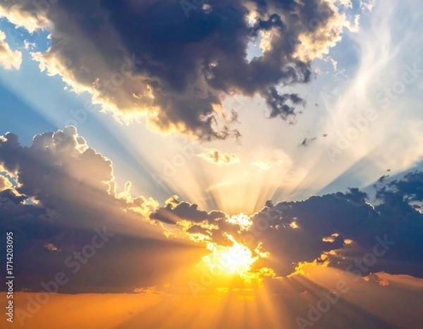 Fototapeta Dramatic sunset sky with sunbeams through clouds