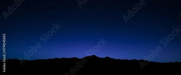 Fototapeta Dark blue, purple, and black washes create a moody, starry night sky over a silhouetted mountain range,  art,  vibrant