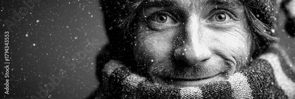 Fototapeta Smiling man in winter attire enjoys snowfall outdoors