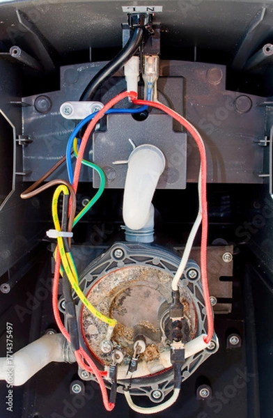 Fototapeta Device of a household steam generator for clothes. Appliance defect - leak.