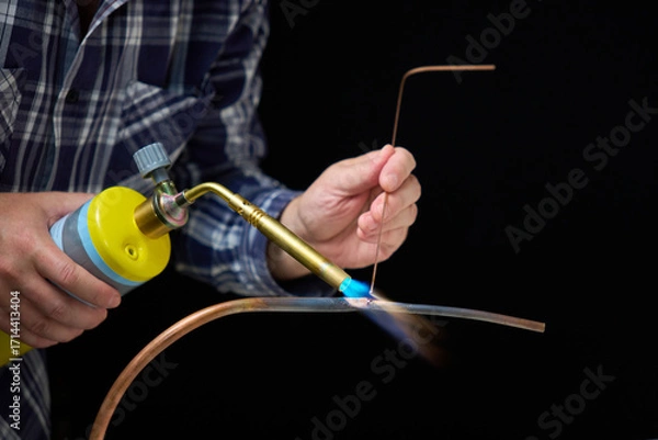 Obraz soldering copper pipes with MAP gas