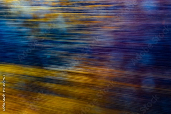 Fototapeta Dynamic motion blur view from high-speed train window: Green landscape, trees & fields rush past at high speed