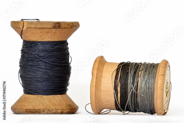 Fototapeta Pair of vintage wooden thread spools rustic needlework concept