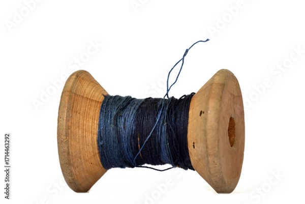 Fototapeta Heritage wooden bobbin with thread minimal white setup
