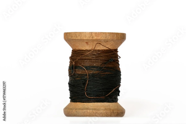 Fototapeta Heritage wooden bobbin with thread minimal white setup