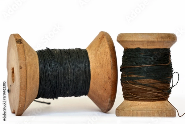 Fototapeta Pair of vintage wooden thread spools rustic needlework concept